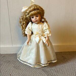 Elegant Cream Doll with Golden Hair